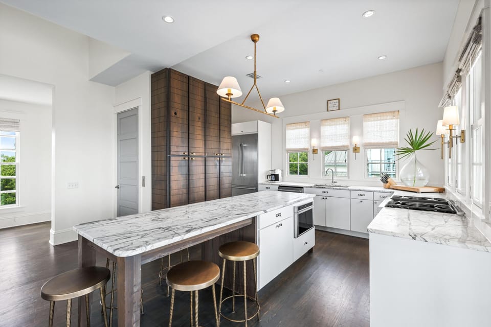 Your spacious gourmet kitchen features marble countertops, premium appliances, and a breakfast bar where you can sip morning coffee in style.