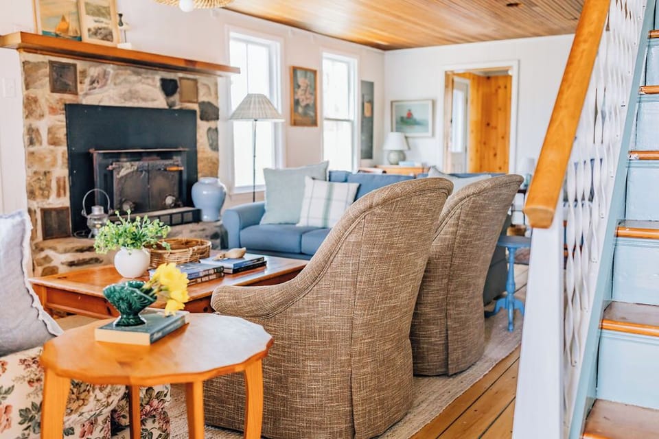 interior, interior staircase, handrail, indoor, couch, living area, fireplace