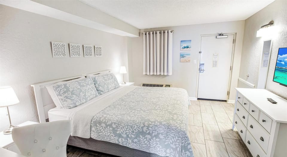 The bedroom comes equipped with window treatments, allowing you to drift off to sleep in total comfort or enjoy a slow, private morning before heading to the balcony.
