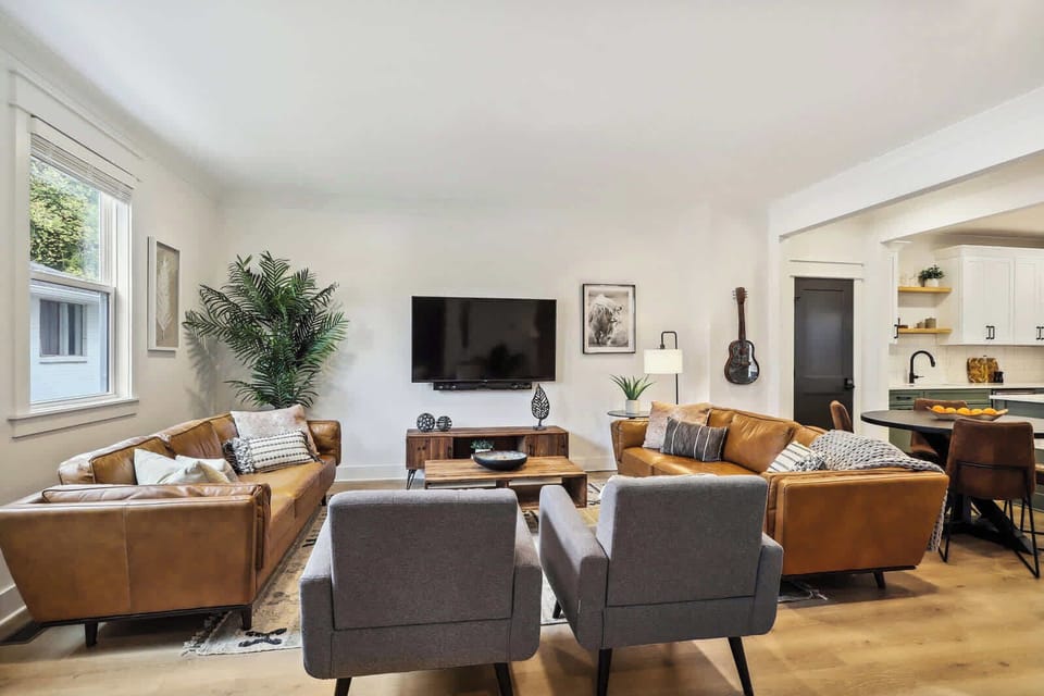Living Room | Open Concept Seating Area with TV | First Floor | Unit B