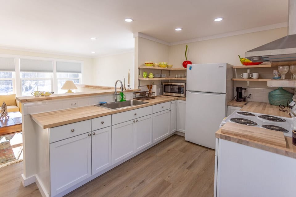 Beautiful open concept kitchen/living/dining areas with natural light
