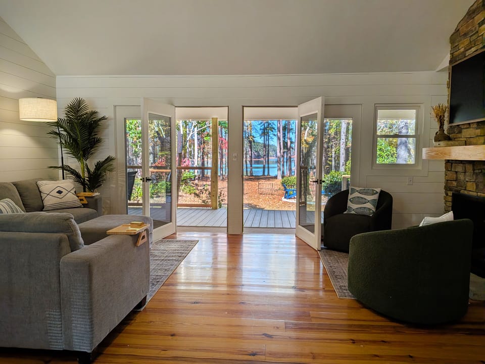 Double doors lead to the expansive deck with several areas to soak up the views.