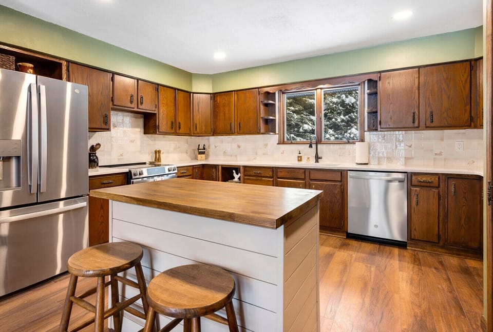 Kitchen: Bright, spacious kitchen with modern appliances and inviting island for gatherings!