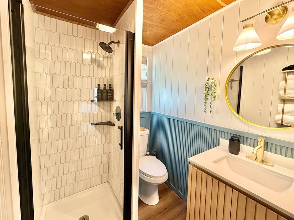 Recently remodeled bathroom with a walk-in tiled shower.