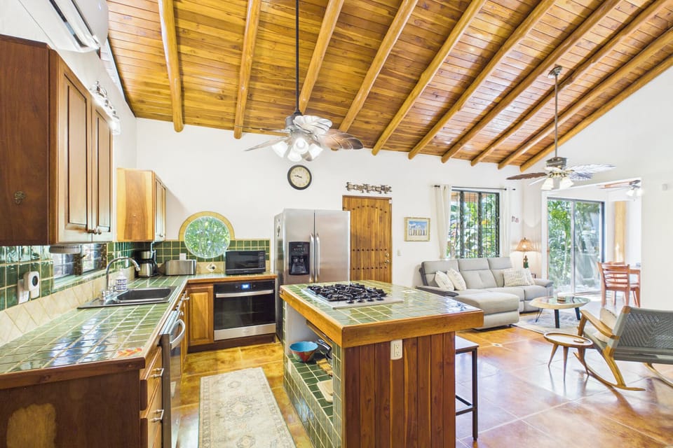 Open Kitchen/ Living Room.  AC in kitchen/living room and all bedrooms.  There is a indoor laundry room with full size washer and dryer off kitchen.  The laundry room has two double doors, food pantry area, and can be used to store/lock valuables.  