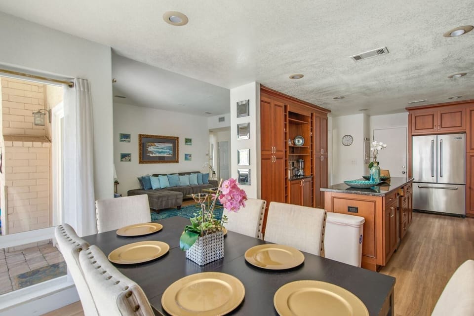 Bright and spacious open floor plan connecting the kitchen, dining, and living spaces for easy gathering.