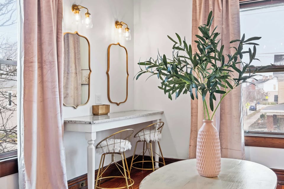 Living Area: A pretty-in-pink living area made for cozy moments and cute vibes with your girls!