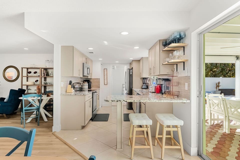 Modern kitchen design with breakfast bar that seats two