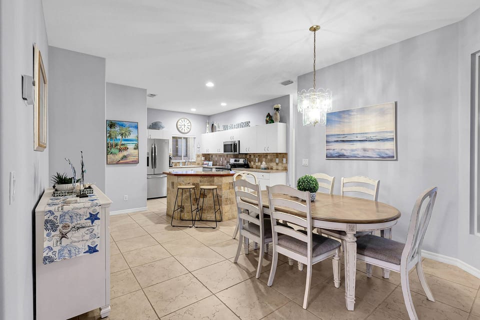 The dining area flows effortlessly from the living room toward the kitchen.