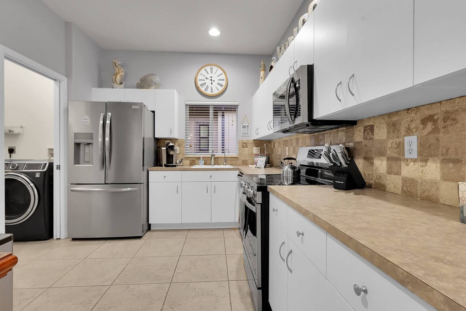 Cookware, dinnerware, many kitchen tools and small appliances are provided for your use, including a Keurig coffee maker.