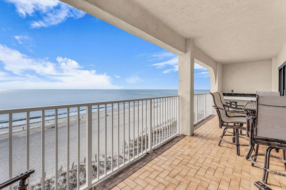 Top-unit beachfront balcony with sweeping Gulf views, ocean breezes, and sunsets
