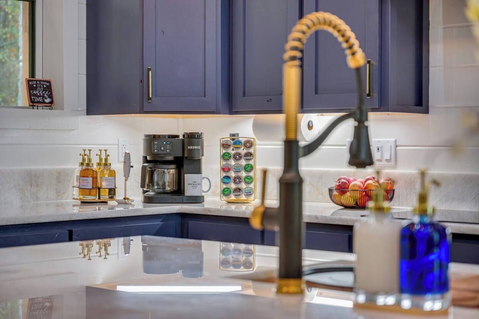Spacious kitchen with elegant quartz countertops, wine-ready island seating, and ready for memorable meals.