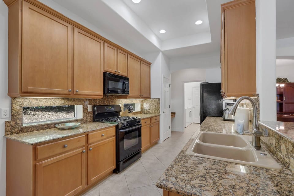 Cookware, dinnerware and other kitchen tools are provided to prepare and serve vacation meals.