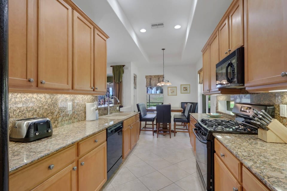 The kitchen is well equipped with a gas stove, dishwasher, refrigerator/freezer and microwave.
