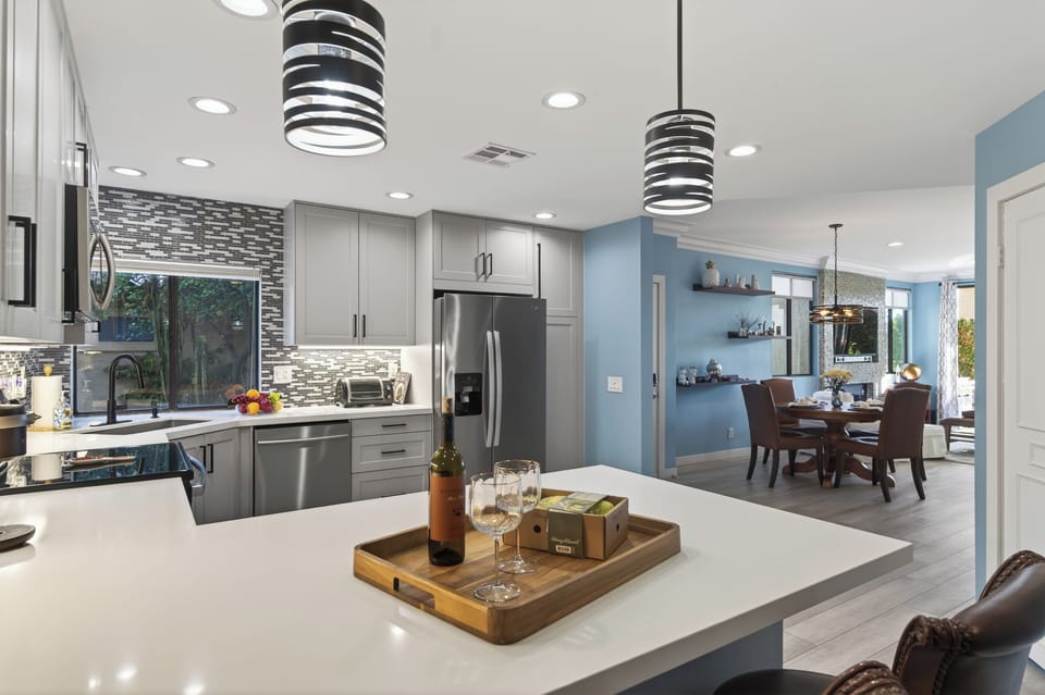 Kitchen island perspective looking toward the dining and living areas.