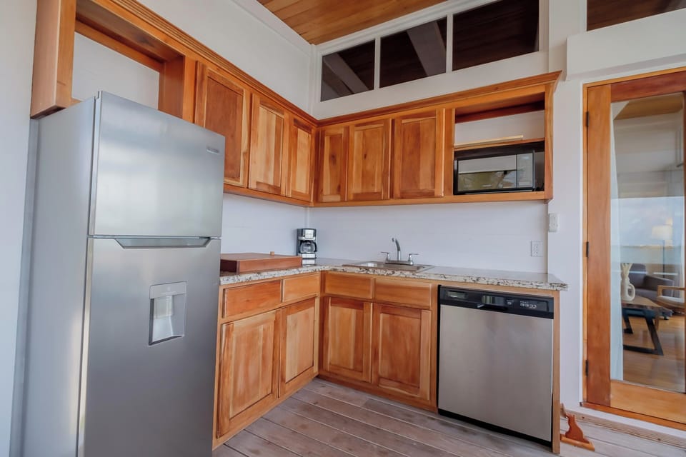 Cook beach-day meals easily in this bright, fully equipped kitchen.