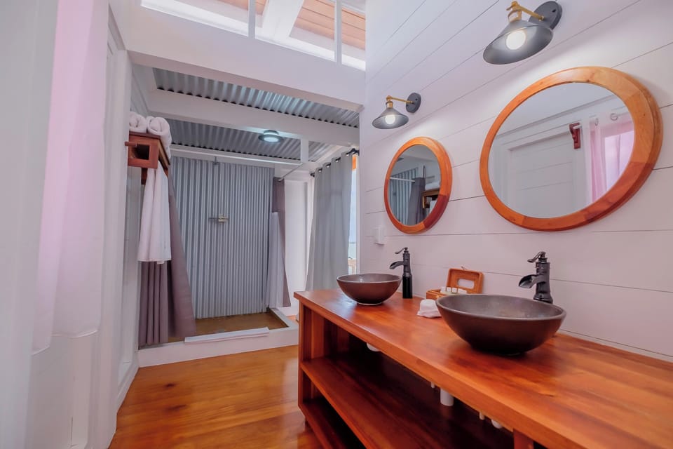 Refresh in a spa-like bath with twin sinks and warm wood.