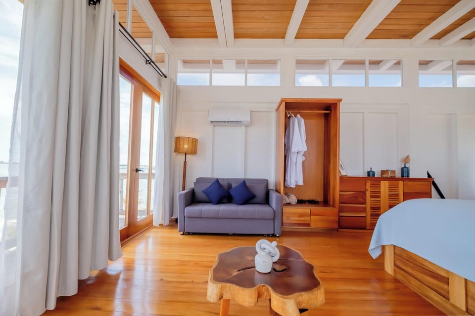 Wake up to sunlit floors and calming coastal minimalism.
