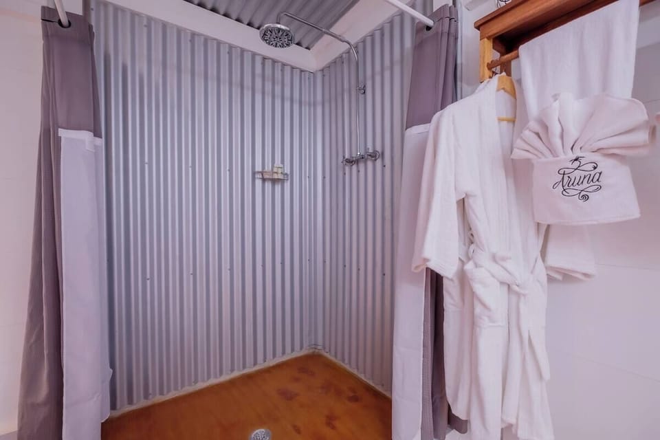Rinse off in the rainfall shower after a sandy beach day.