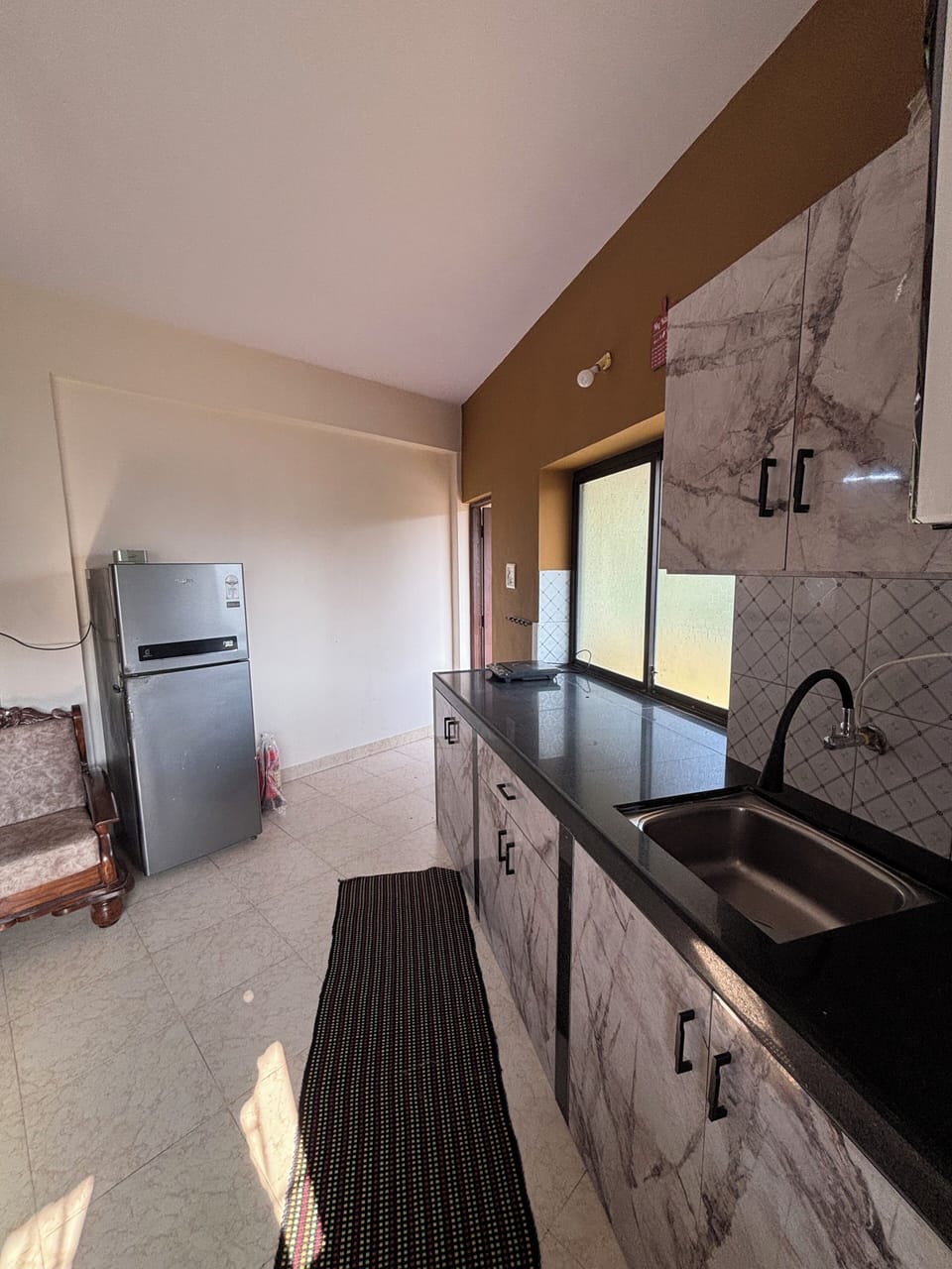 Kitchen view with fridge