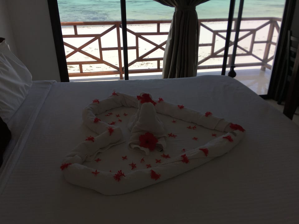 Standard Room, Beach View | Desk, blackout drapes, free WiFi