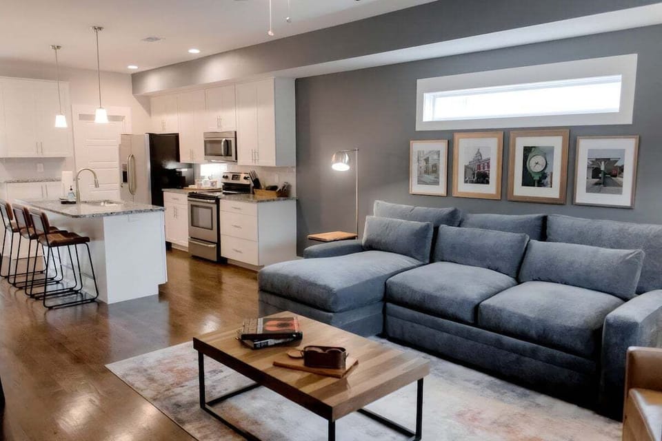 Downstairs open concept spacious well stocked kitchen, comfy living room, dining room and 1/2 bath.