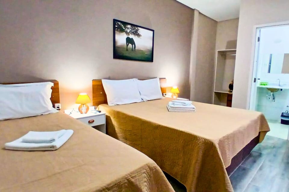 Classic Triple Room, Courtyard View | Pillowtop beds, iron/ironing board, free WiFi, bed sheets