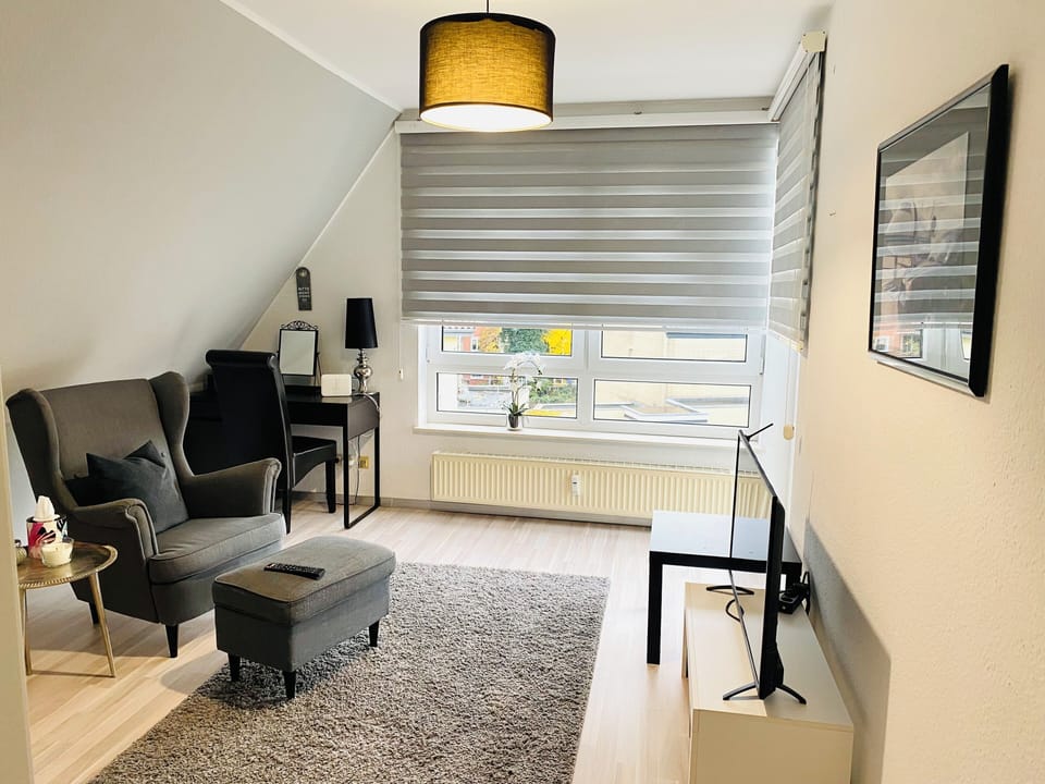 Deluxe Apartment, Balcony, City View | Living area | 30-inch flat-screen TV with cable channels, DVD player