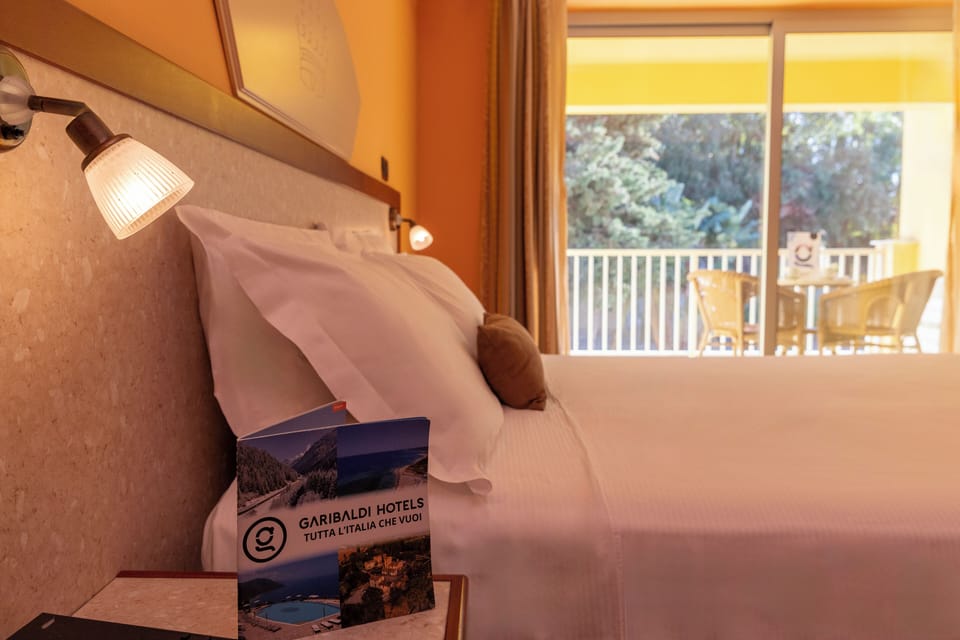 Standard Quadruple Room, Balcony | In-room safe, desk, laptop workspace, free WiFi
