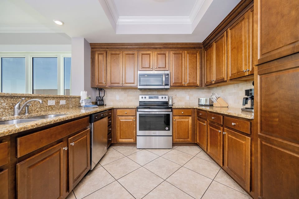 Craft gourmet meals in the spacious kitchen, complete with stainless appliances and ample counter space