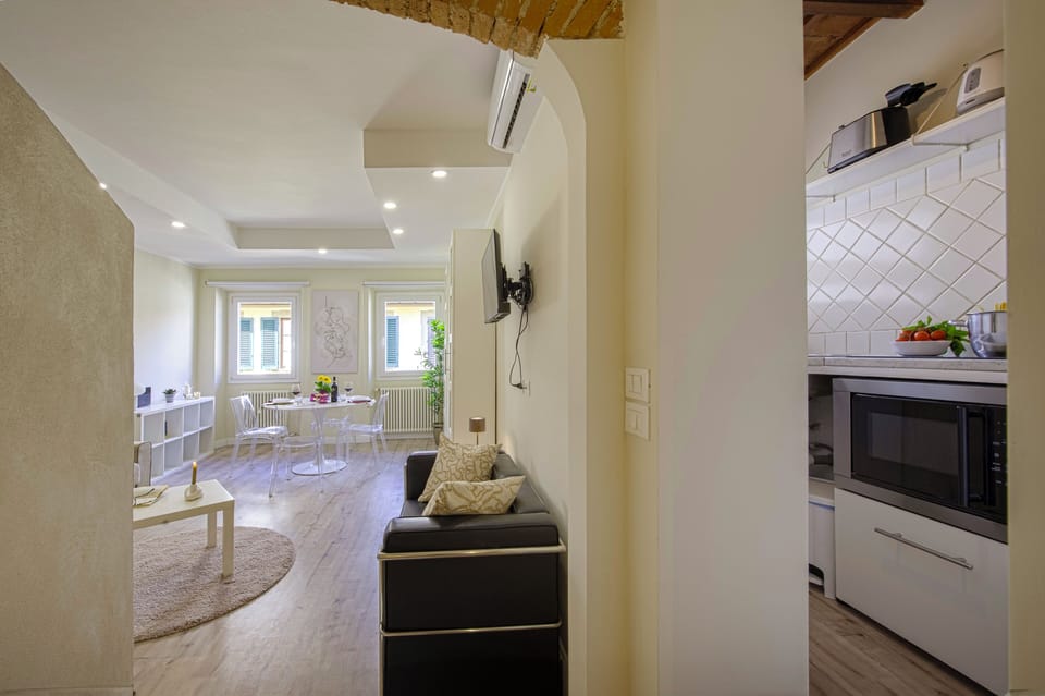 Apartment (1 Bedroom) | Living area | 32-inch TV with cable channels