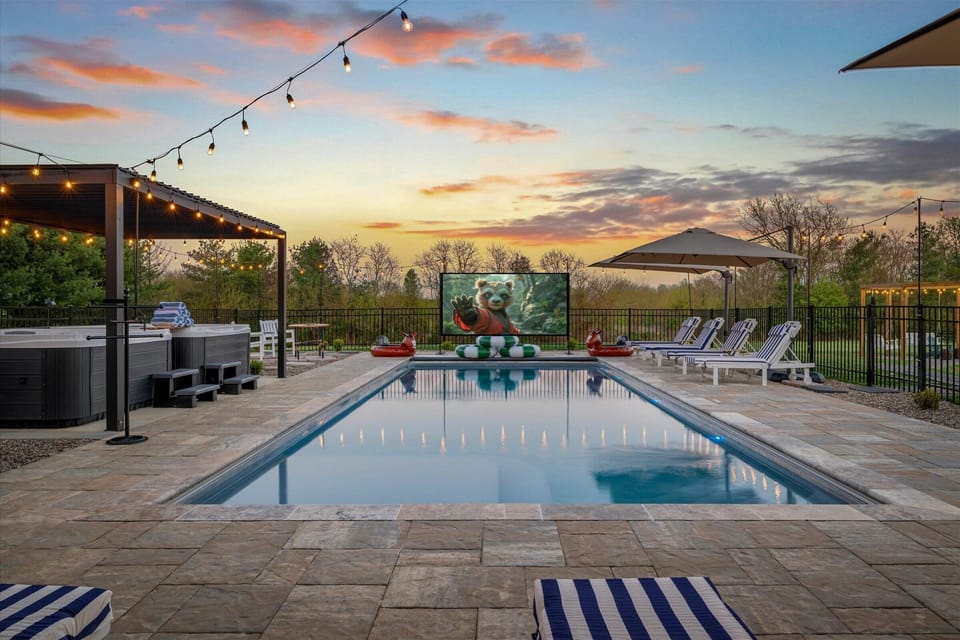 Poolside movie nights under the stars. Easy screen setup!