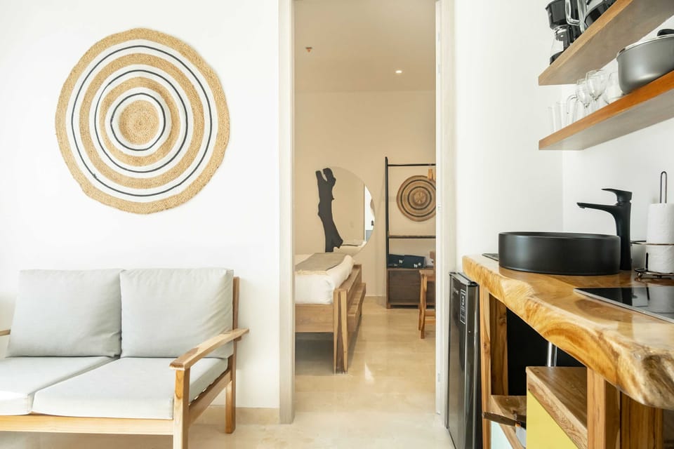 Living room with sofa and equipped kitchen