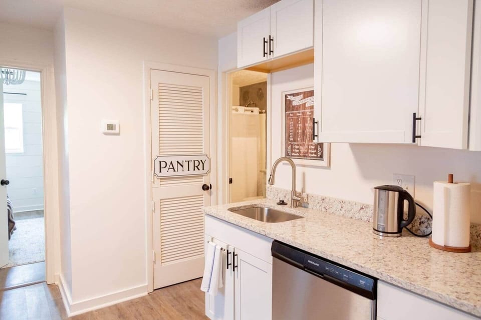 Calming Terracotta Chateau - Kitchen with stainless steel appliances and granite counter tops.