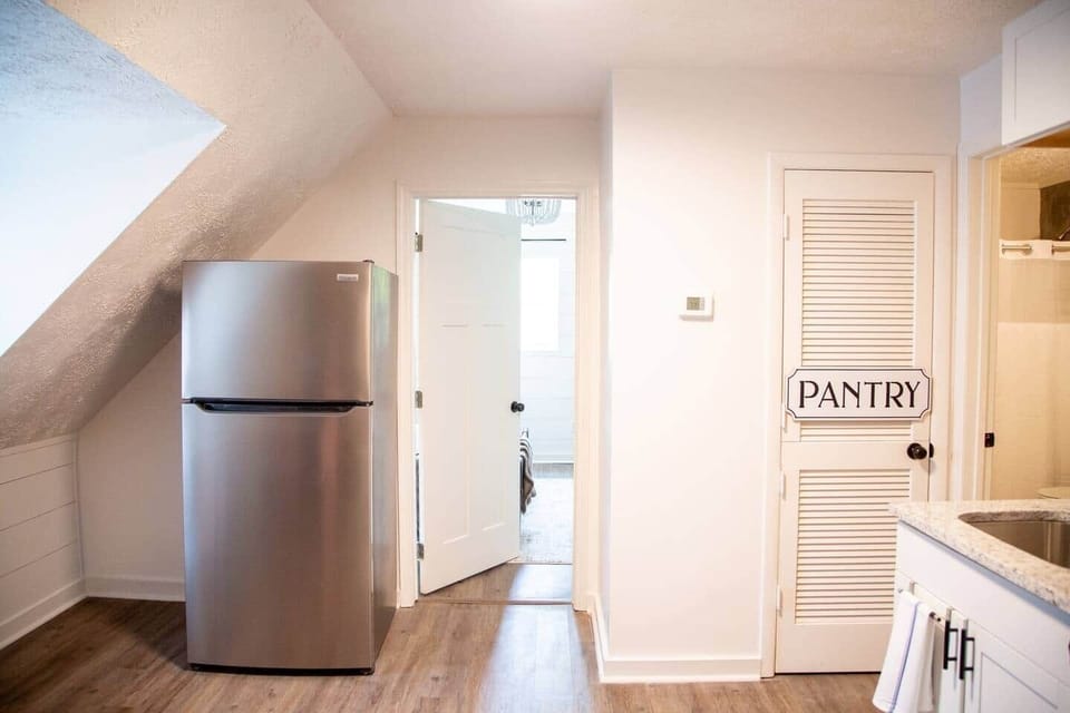 Calming Terracotta Chateau - kitchen with full sized, stainless steel refrigerator.