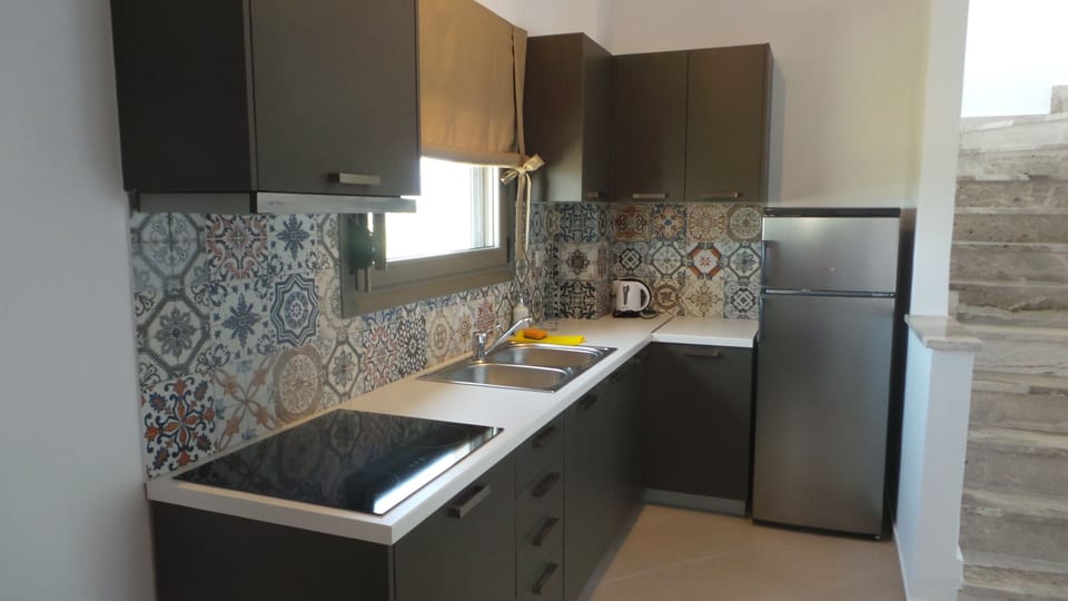 Deluxe Duplex, 2 Bedrooms | Private kitchen | Full-size fridge, oven, stovetop, coffee/tea maker