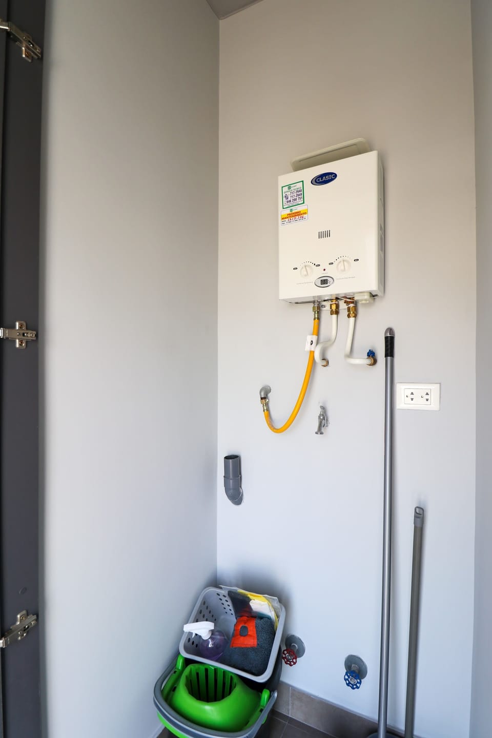 Laundry area with washer and supplies