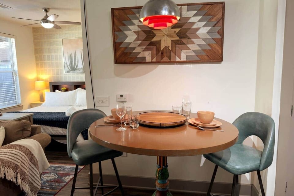 Hand painted dining table and groovy light fixture from the atomic age!