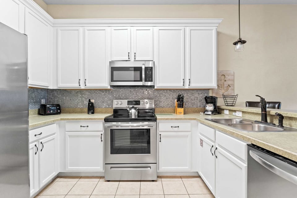 Condo, Multiple Beds, Patio, Garden View (Serenity at Bahama Bay) | Private kitchen | Coffee/tea maker