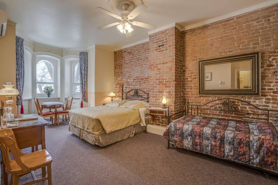 Standard Room, Multiple Beds, Private Bathroom | Desk, blackout drapes, iron/ironing board, free WiFi