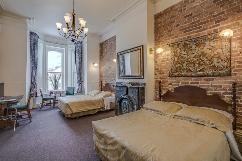 Room, 2 Queen Beds | Desk, blackout drapes, iron/ironing board, free WiFi