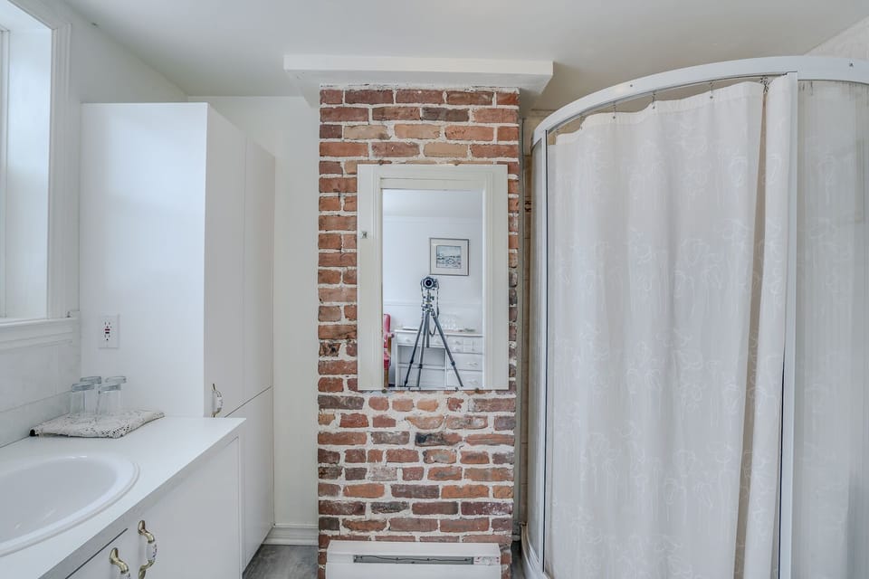 Room, Multiple Beds, Private Bathroom | Bathroom | Combined shower/tub, free toiletries, hair dryer, slippers