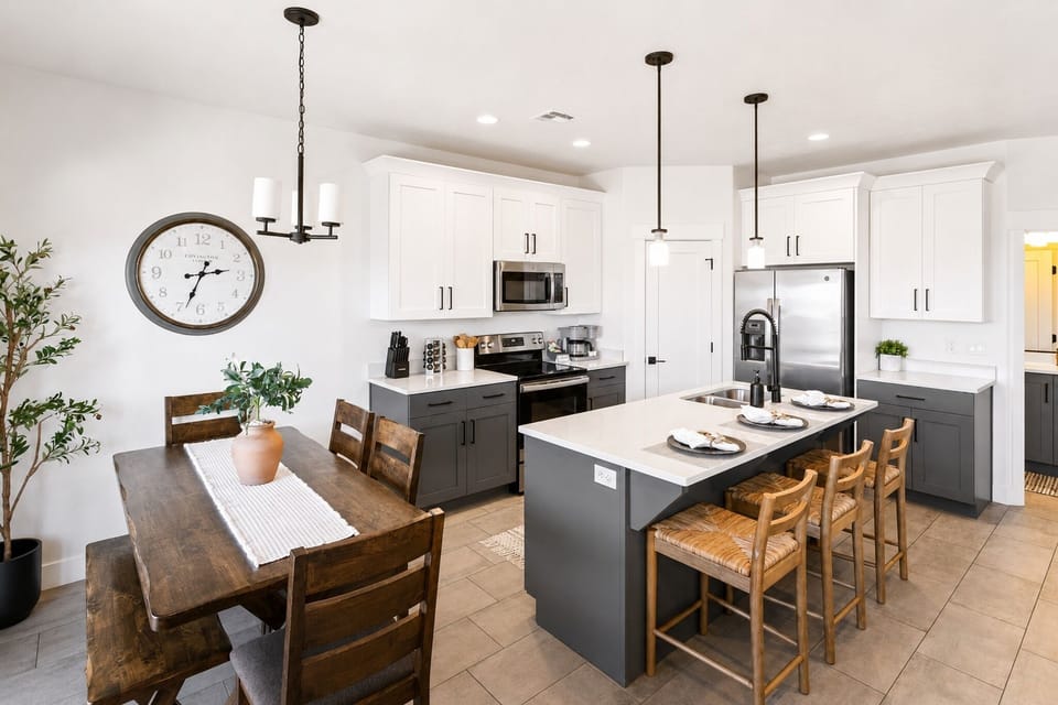 Bright modern kitchen with large island, bar seating & dining space