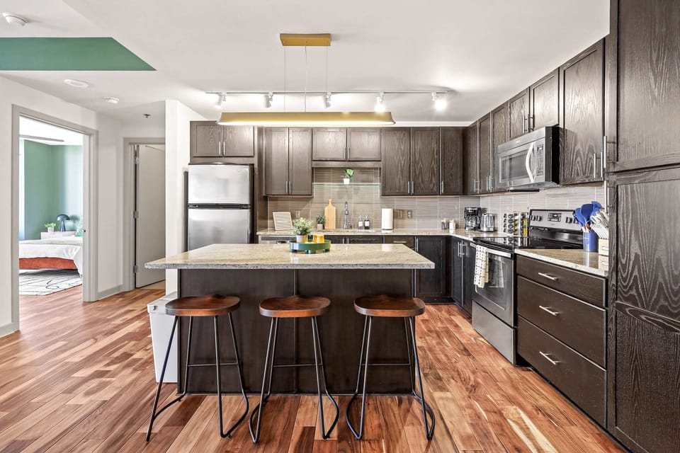 Spacious and beautifully designed, this kitchen features sleek stainless steel appliances and a welcoming breakfast bar, perfect for casual dining, morning coffee, or gathering with family and friends. ✨🍽️