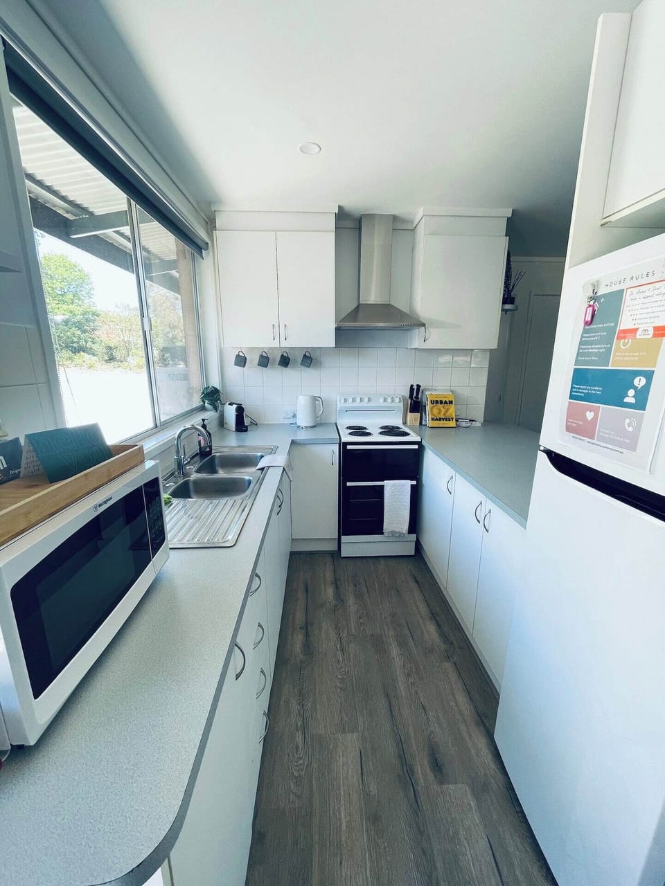 Fully equip kitchen, open & bright
Bar seating area for breaky with the kids, study or support while cooking ;)

All you need - including the kitchen sink ;)

Electric Stove
Fridge/freezer
microwave
pots/pans
Rice cooker
Sandwhich press
Crockery etc