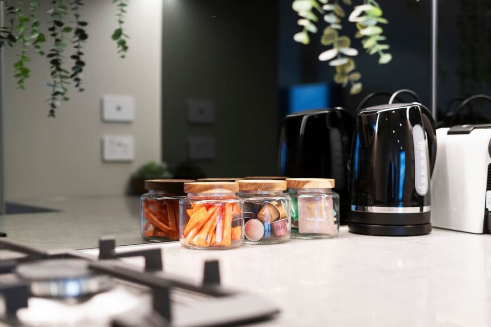 Complimentary tea, coffee, and pantry essentials are provided, along with a fully stocked kitchen equipped for both cooking and baking.