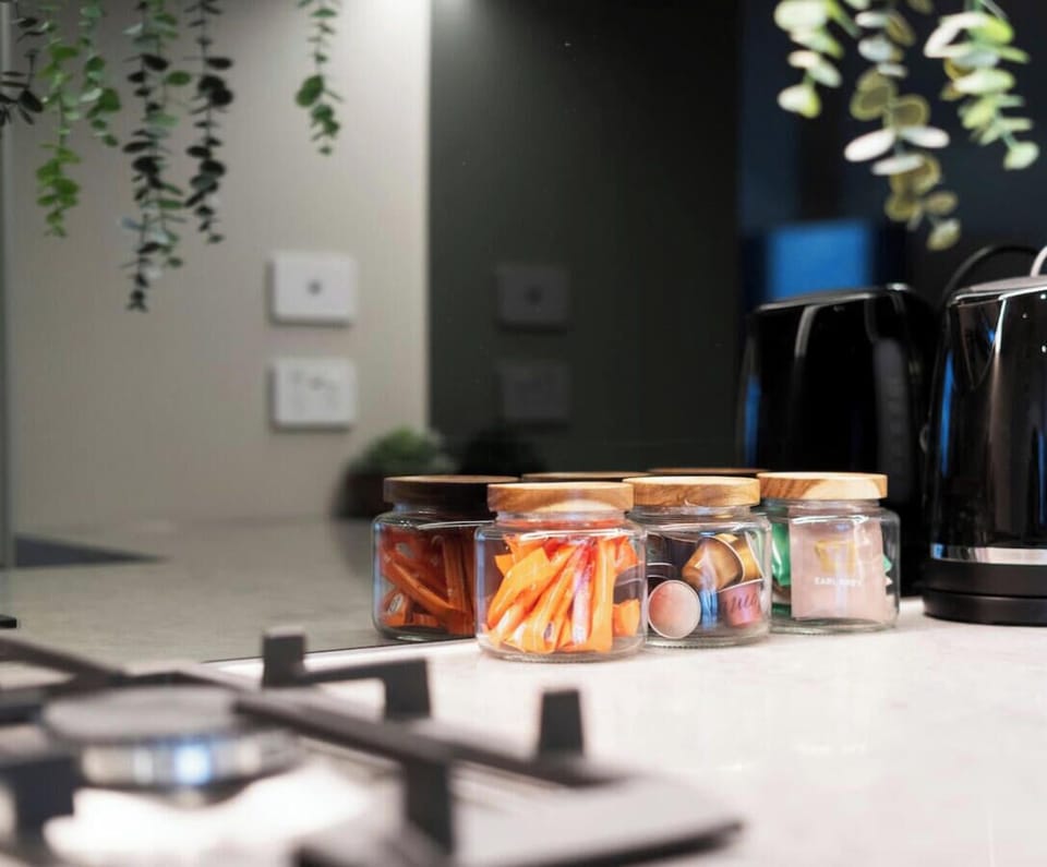 Complimentary tea, coffee, and pantry essentials are provided, along with a fully stocked kitchen equipped for both cooking and baking.