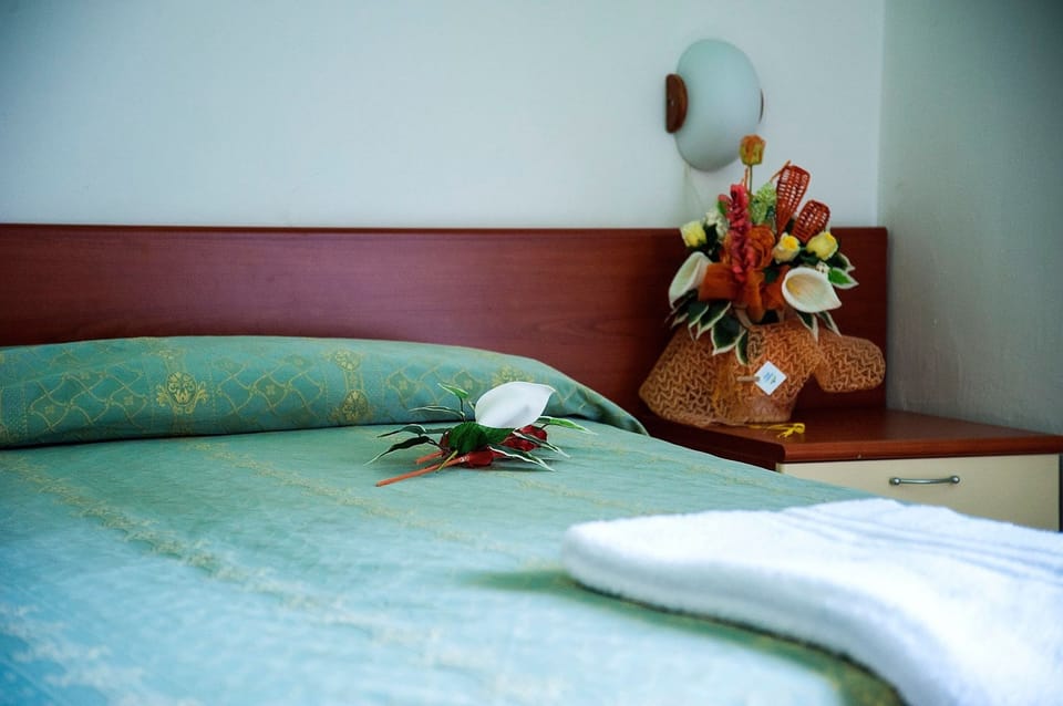 Standard Triple Room, Balcony | Down comforters, in-room safe, desk, blackout drapes