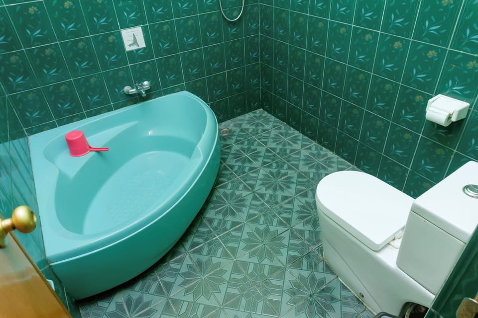 Deluxe Double or Twin Room, Non Smoking, Mountain View | Bathroom | Slippers, towels, soap, shampoo