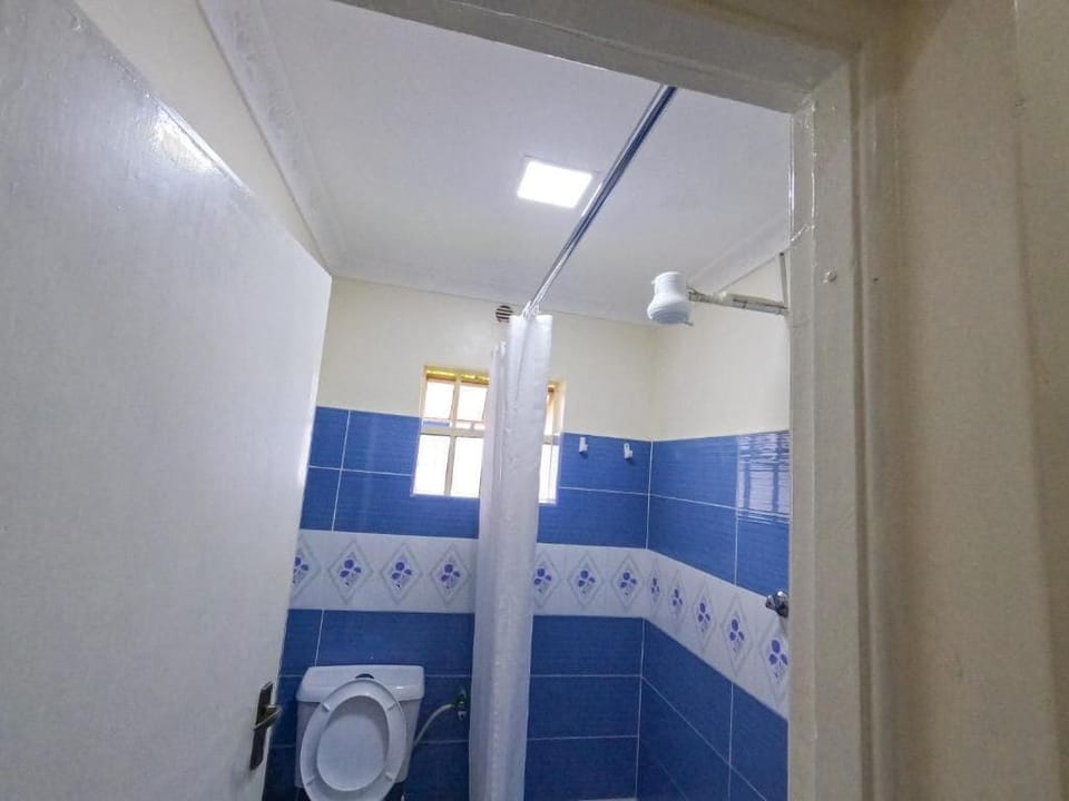 Standard Double Room | Bathroom | Shower, slippers, towels, soap
